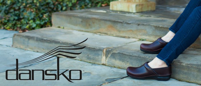 Dansko footwear brand photograph showing clogs worn on outdoor steps
